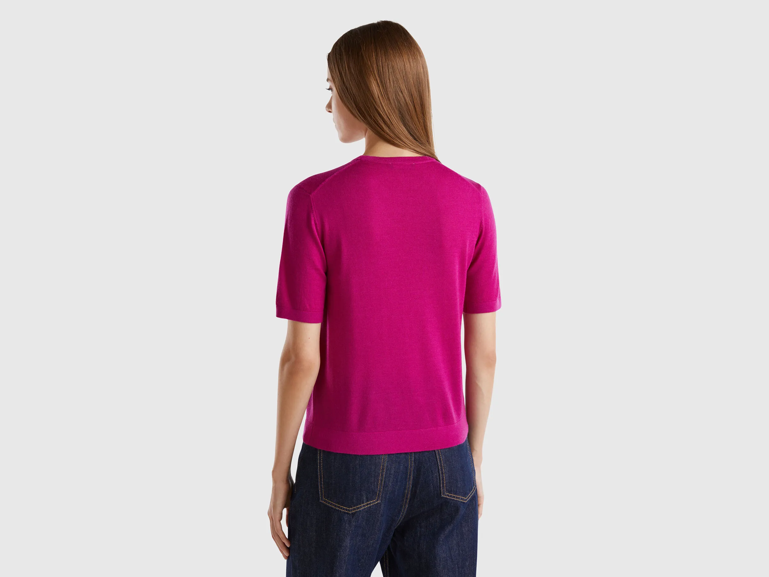 Short sleeve sweater in pure Merino wool - Cyclamen | Benetton